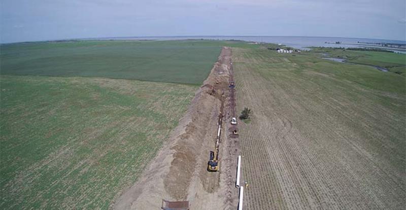 Water system parallel piping along raw water pipes